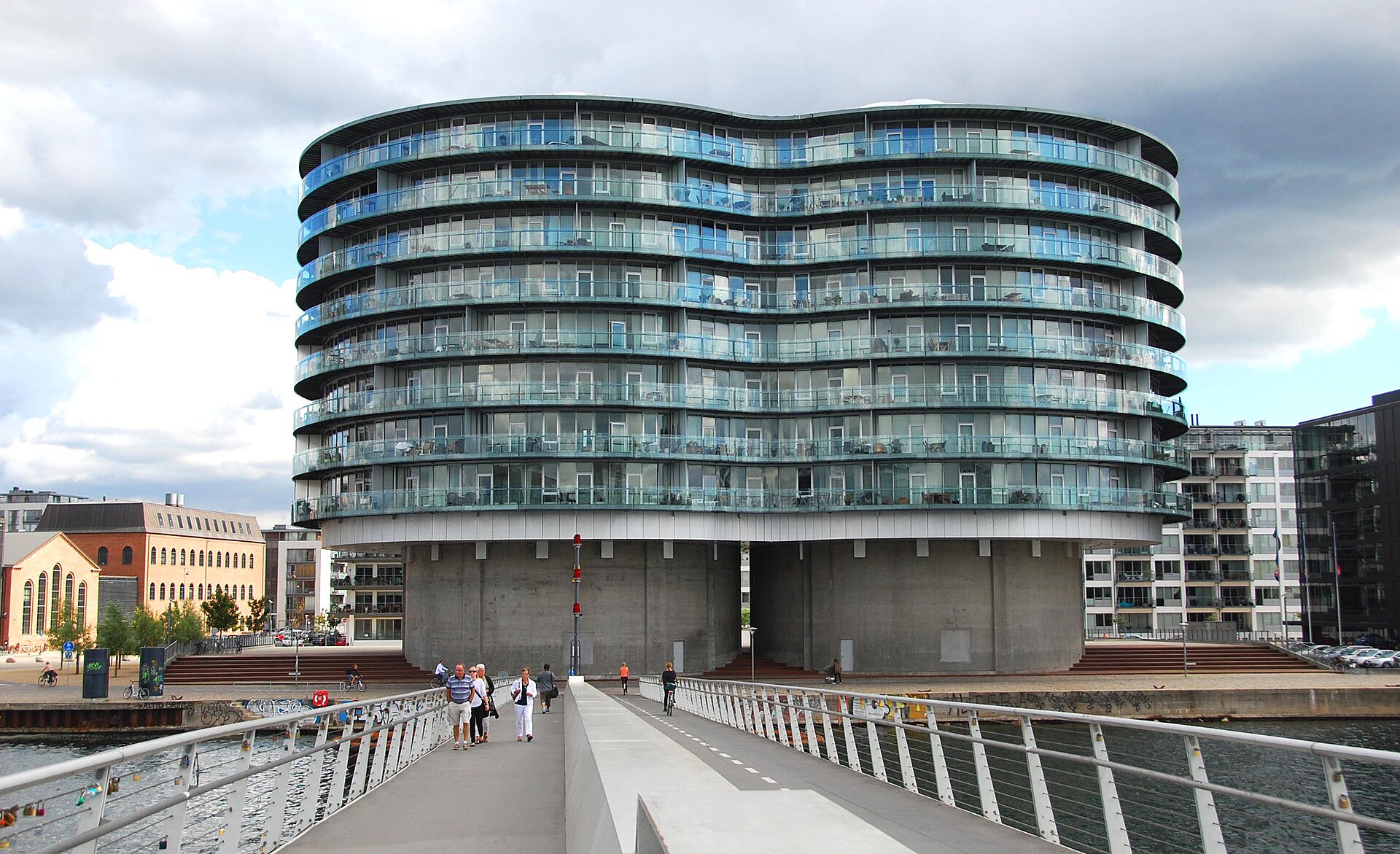 Public harbour promenade beside Gemini Residence on Islands Brygge, set back from the water and outside residential entrances.
