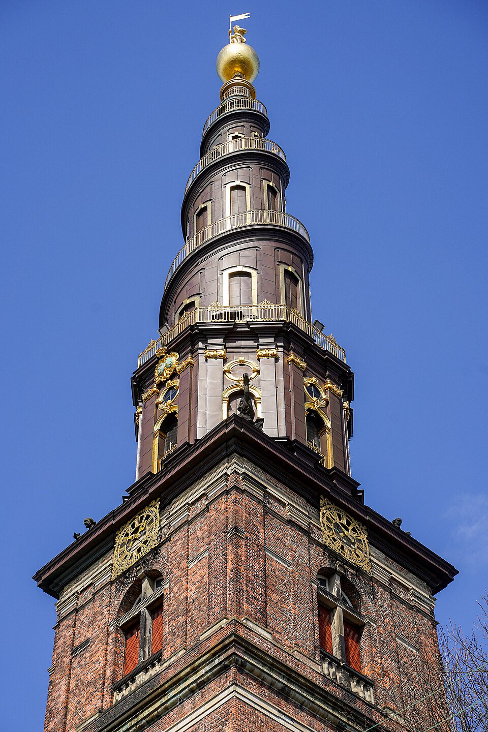 Public pavement on Sankt Annæ Gade outside Our Saviour’s Church, facing the spiral spire and clear of the tower queue.