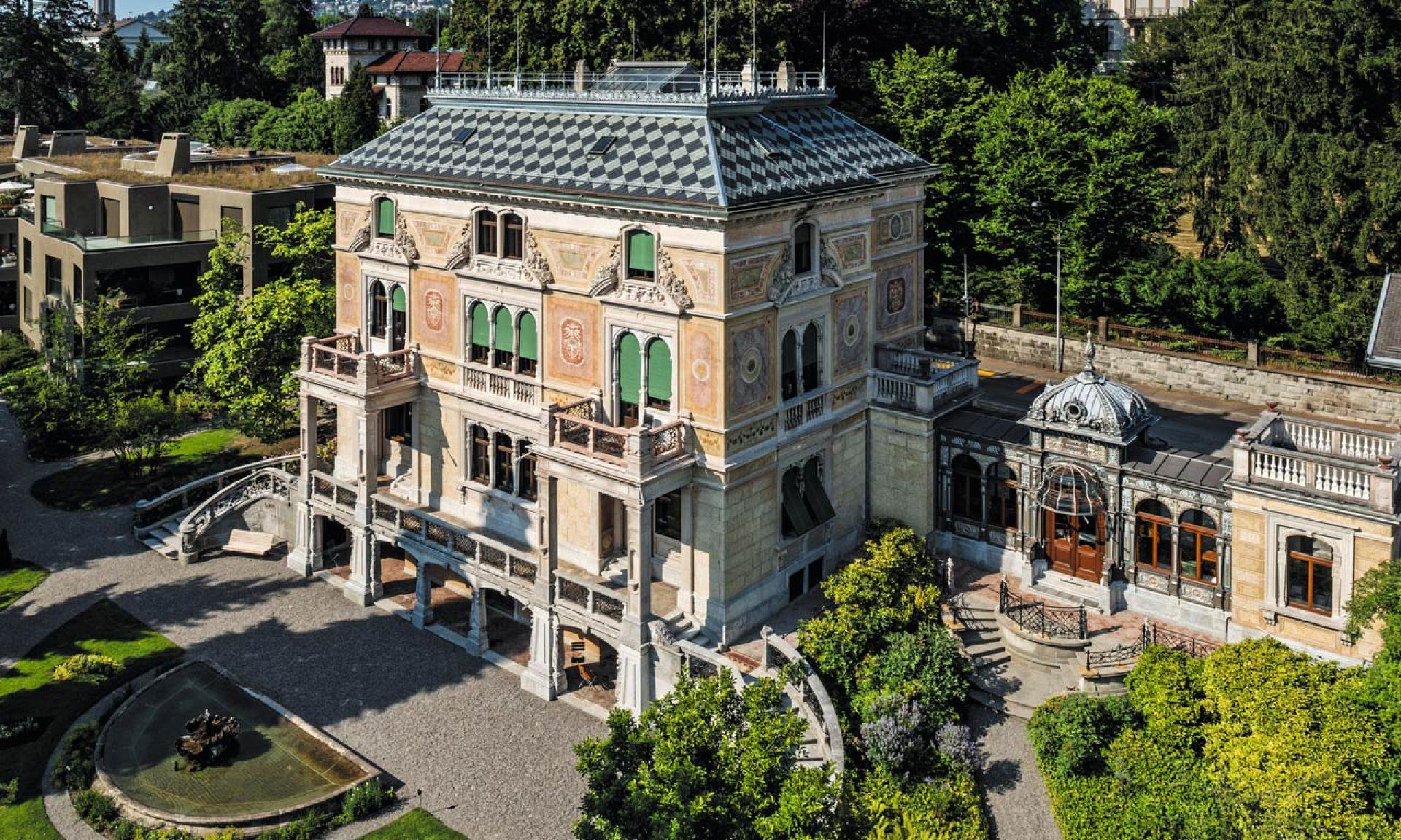 Public park path facing Villa Patumbah, Zollikerstrasse 128, without entering the house or restricted garden areas.