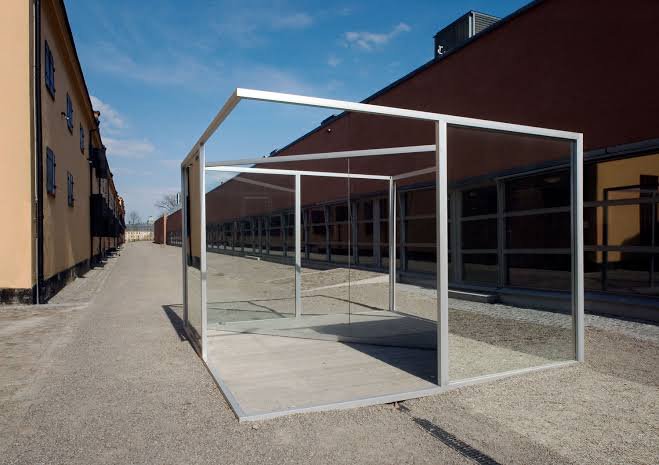 Public path beside Dan Graham’s Pavilion Sculpture II, outside Moderna Museet’s main entrance on Skeppsholmen. Observe the reflections from beside the glass without touching it.
