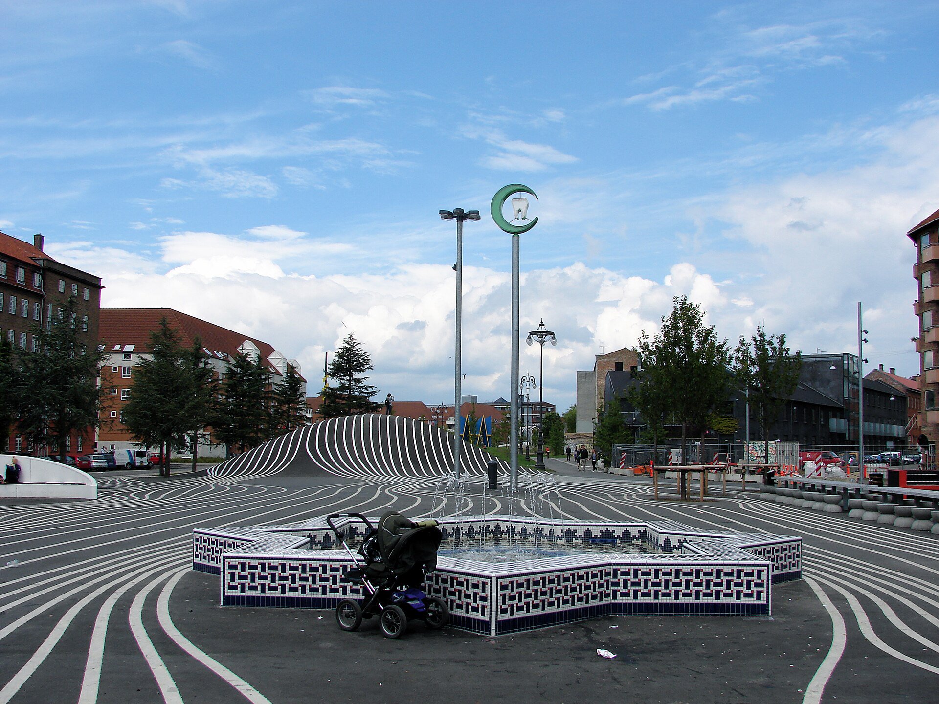 Pedestrian area beside the Moroccan fountain in Superkilen’s Black Square, away from the cycle route.