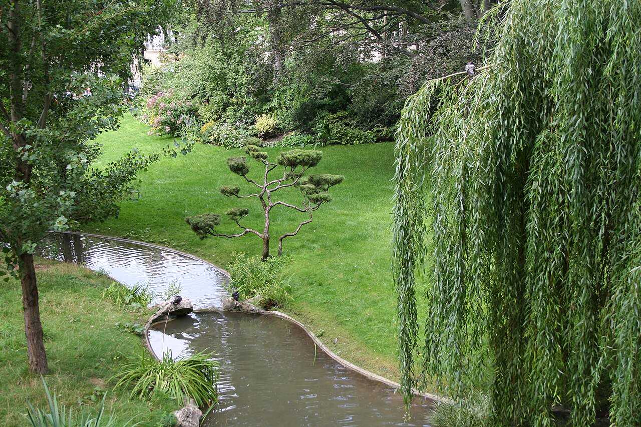 Public path beside the pond in Square des Batignolles, 75017 Paris. Leave room for people passing.