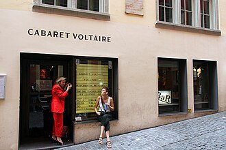 Public pavement outside Cabaret Voltaire on Spiegelgasse, leaving the entrance clear.