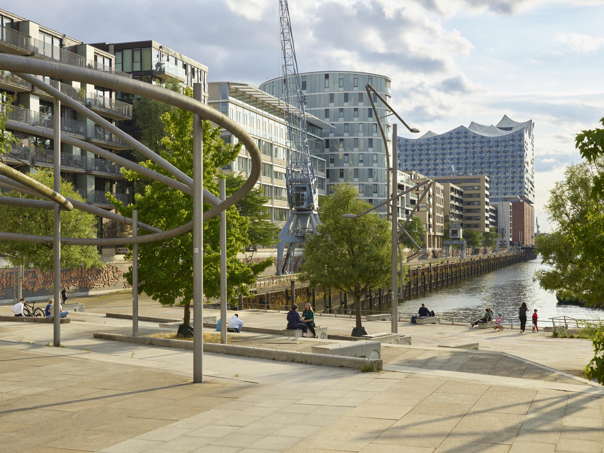 Upper public level of Magellan-Terrassen overlooking Sandtorhafen, away from the stair edge.