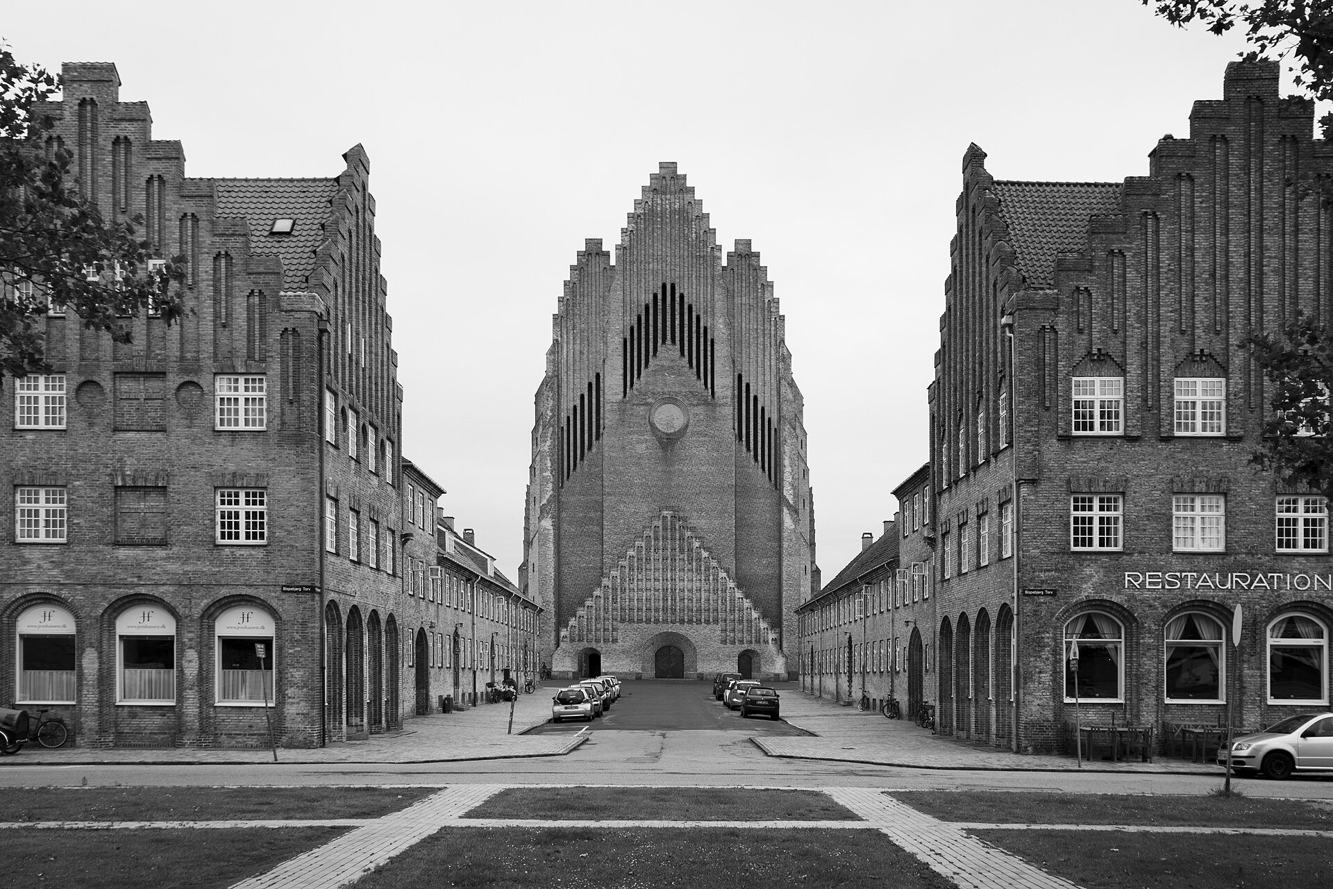 Public pavement facing the western tower façade of Grundtvigs Kirke on På Bjerget, Copenhagen; keep the church entrance clear.
